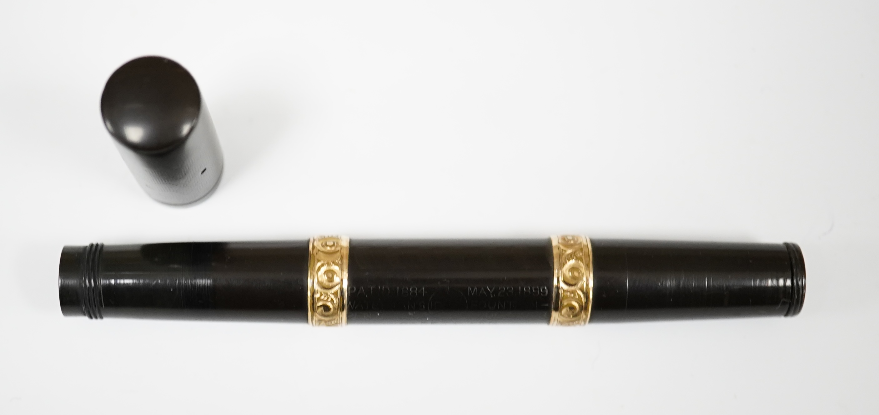 A Waterman 15vs safety black fountain pen with gold filled barrel bands and 14ct. Waterman gold nib